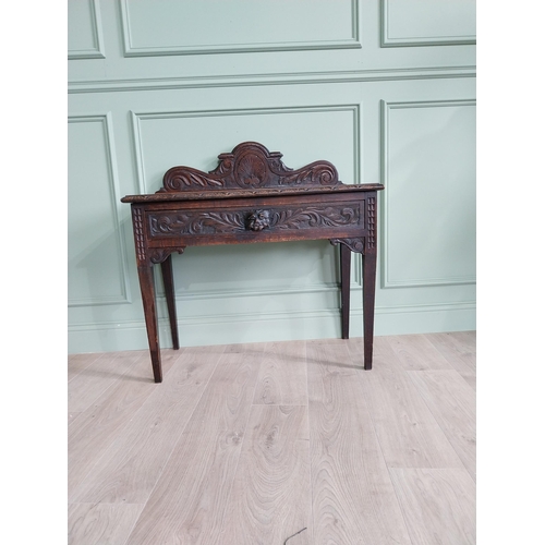 133 - 19th C. carved oak side table with decorative gallery back and single drawer in the frieze raised on... 