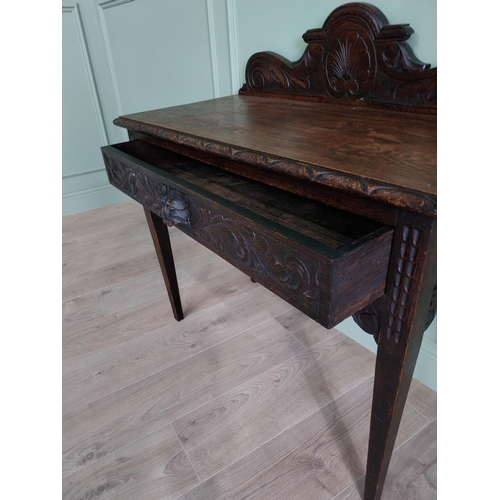 133 - 19th C. carved oak side table with decorative gallery back and single drawer in the frieze raised on... 