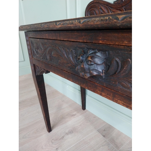 133 - 19th C. carved oak side table with decorative gallery back and single drawer in the frieze raised on... 