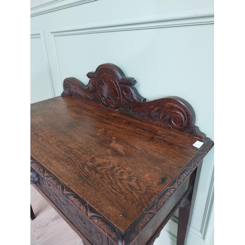 133 - 19th C. carved oak side table with decorative gallery back and single drawer in the frieze raised on... 