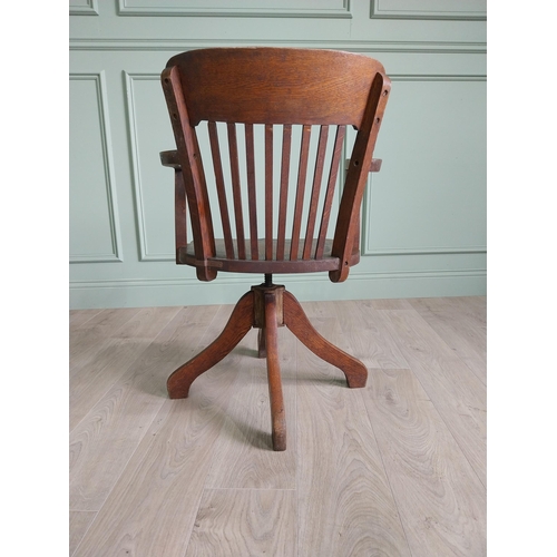 136 - 1940s oak desk chair {85 cm H x 54 cm W x 52 cm D}.