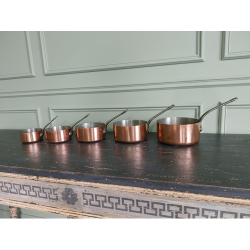 143 - Set of five French copper saucepans {20 cm H x 39 cm W x 20 cm D and 13 cm H x 22 cm W x 12 cm D}.