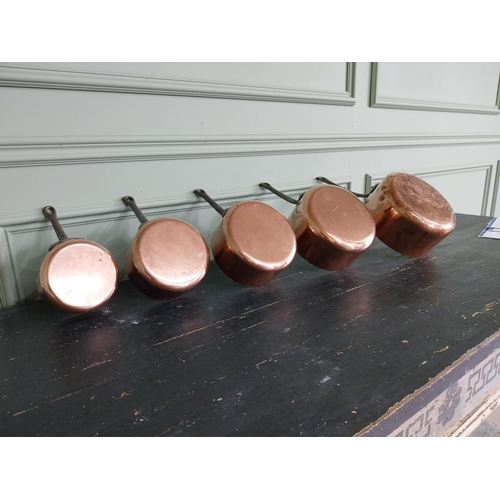 143 - Set of five French copper saucepans {20 cm H x 39 cm W x 20 cm D and 13 cm H x 22 cm W x 12 cm D}.