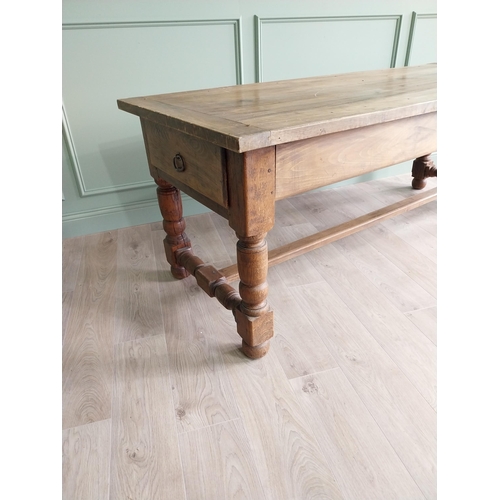 151 - Good quality oak kitchen table raised on turned legs and single stretcher {79 cm H x 210 cm W x 82 c... 