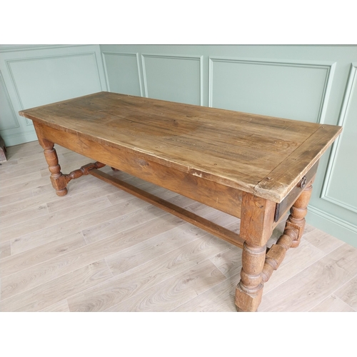 151 - Good quality oak kitchen table raised on turned legs and single stretcher {79 cm H x 210 cm W x 82 c... 