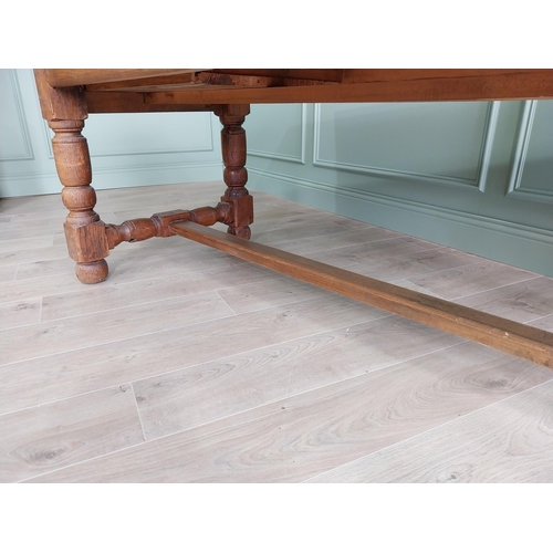 151 - Good quality oak kitchen table raised on turned legs and single stretcher {79 cm H x 210 cm W x 82 c... 