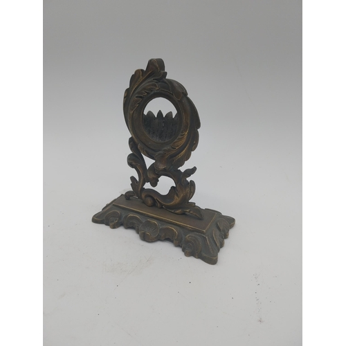 163 - Decorative brass pocket watch stand in the Rococo style {17 cm H x 14 cm W x 7 cm D}.