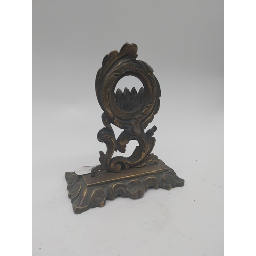 163 - Decorative brass pocket watch stand in the Rococo style {17 cm H x 14 cm W x 7 cm D}.