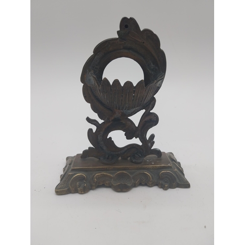 163 - Decorative brass pocket watch stand in the Rococo style {17 cm H x 14 cm W x 7 cm D}.