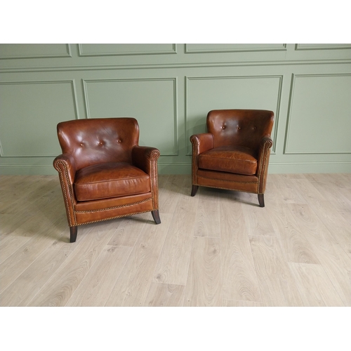 170 - Pair of exceptional quality French hand dyed leather tub chairs with brass studs raised on mahogany ... 