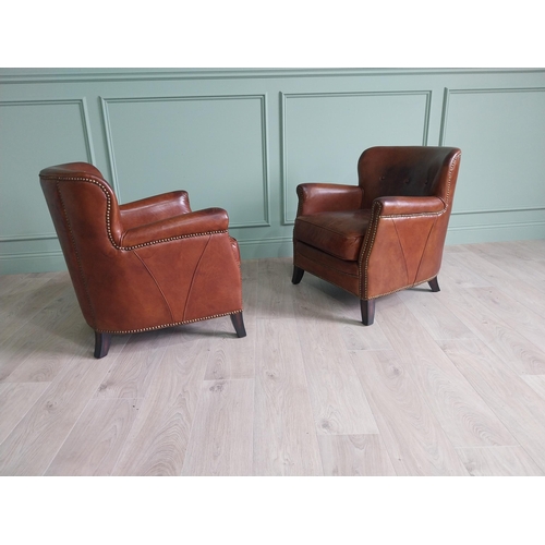 170 - Pair of exceptional quality French hand dyed leather tub chairs with brass studs raised on mahogany ... 