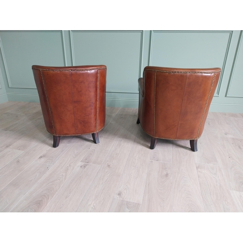 170 - Pair of exceptional quality French hand dyed leather tub chairs with brass studs raised on mahogany ... 