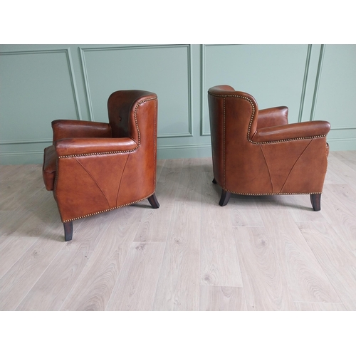 170 - Pair of exceptional quality French hand dyed leather tub chairs with brass studs raised on mahogany ... 