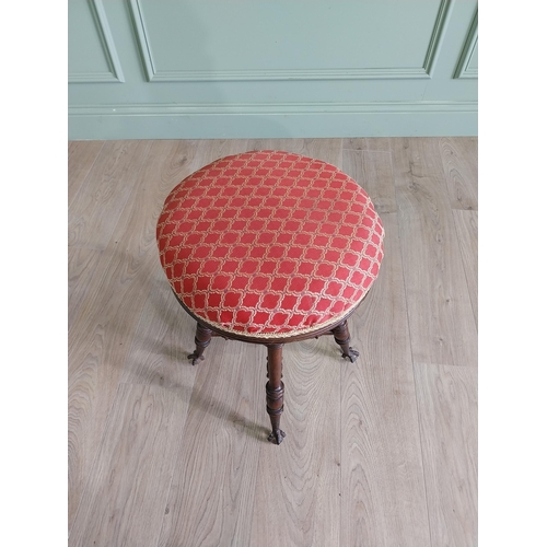 175 - Edwardian mahogany revolving stool with upholstered seat raised on turned legs and ball & claw feet ... 