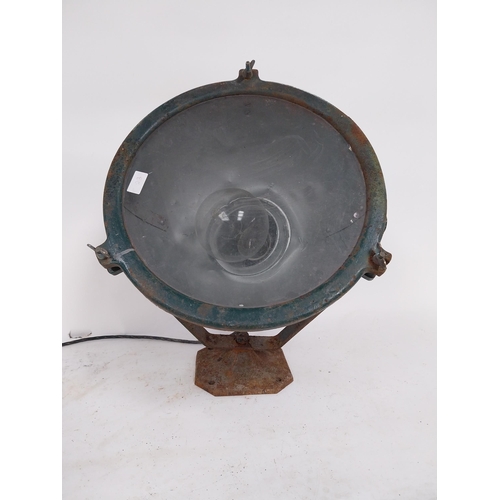 18 - Early 20th C. metal search light on original stand {55 cm H x 48 cm W x 55 cm D}.