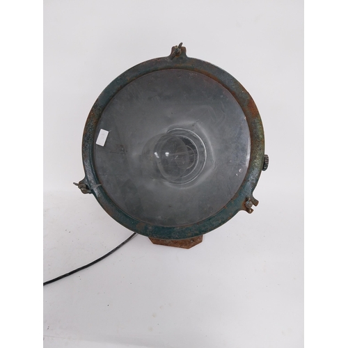 18 - Early 20th C. metal search light on original stand {55 cm H x 48 cm W x 55 cm D}.