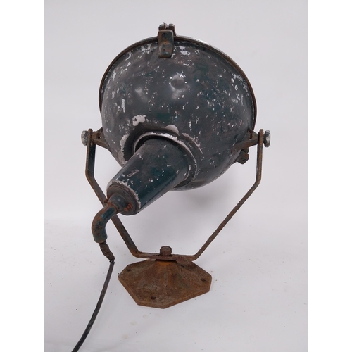 18 - Early 20th C. metal search light on original stand {55 cm H x 48 cm W x 55 cm D}.