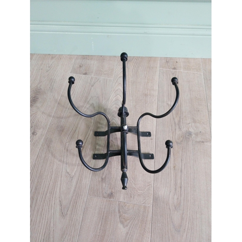 191 - Wrought iron wall mounted hat and coat stand {30 cm H x 35 cm W x 27 cm D}.