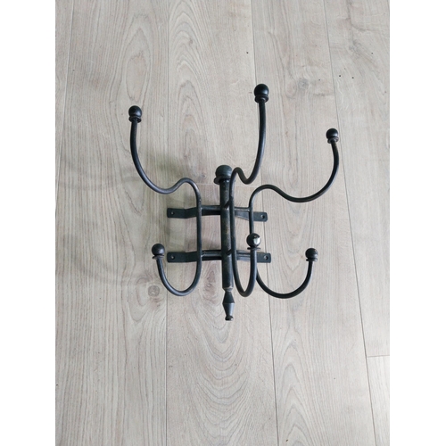 191 - Wrought iron wall mounted hat and coat stand {30 cm H x 35 cm W x 27 cm D}.