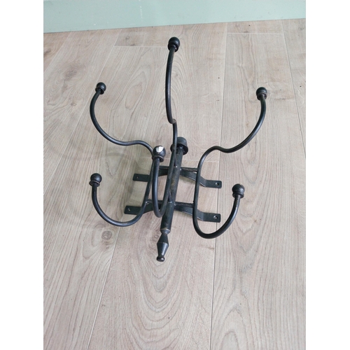 191 - Wrought iron wall mounted hat and coat stand {30 cm H x 35 cm W x 27 cm D}.