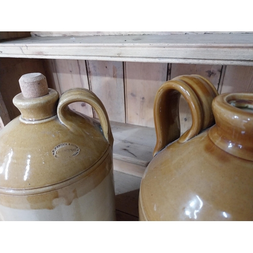 209 - Two early 20th C. stoneware flagons {35 cm H x 20 cm Dia. And 35 cm H x 18 cm Dia.}.