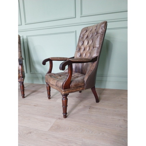 217 - Pair of good quality deep buttoned leather upholstered library chairs on turned tapered legs. {108 c... 