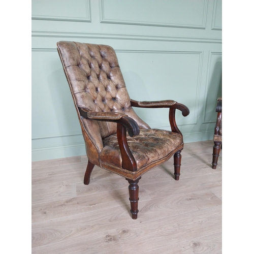 217 - Pair of good quality deep buttoned leather upholstered library chairs on turned tapered legs. {108 c... 