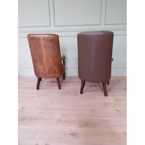 217 - Pair of good quality deep buttoned leather upholstered library chairs on turned tapered legs. {108 c... 