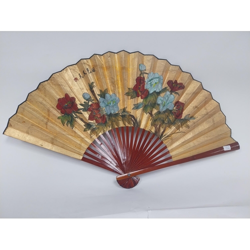 218 - 1950s Oriental gilded fan {60 cm H x 108 cm W}.
