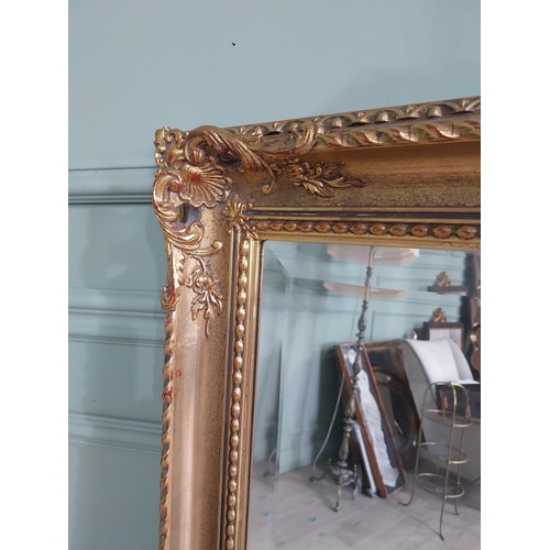 220 - Good quality gilt wall mirror in the Victorian style {139 cm H x 76 cm W}.