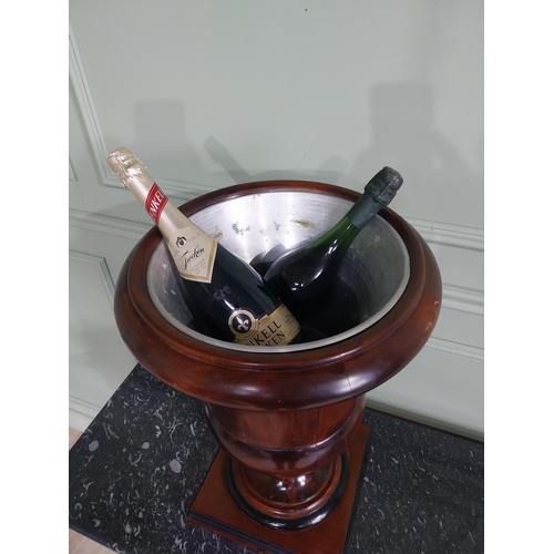 222 - Good quality walnut wine cooler with liner in the Georgian style {59 cm H x 38 cm Dia.}.