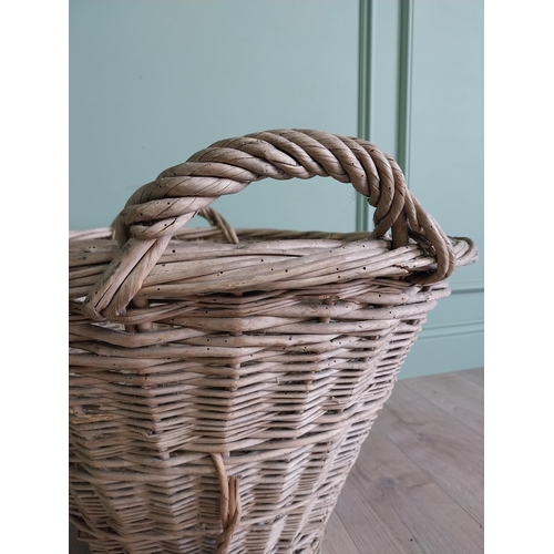 234 - Two early 20th C. wicker baskets {40 cm H x 50 cm W x 48 cm D and 47 cm H x 67 cm W x 54 cm D}.
