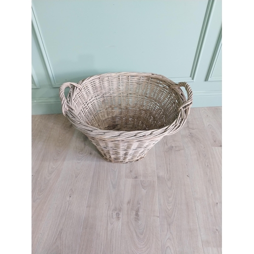 234 - Two early 20th C. wicker baskets {40 cm H x 50 cm W x 48 cm D and 47 cm H x 67 cm W x 54 cm D}.