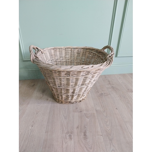 234 - Two early 20th C. wicker baskets {40 cm H x 50 cm W x 48 cm D and 47 cm H x 67 cm W x 54 cm D}.