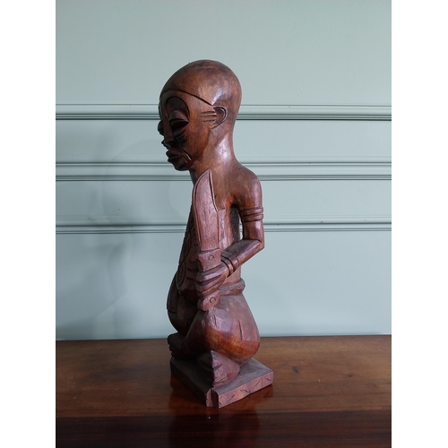 235 - Carved hardwood African figure {64 cm H x 16 cm W x 15 cm D}.