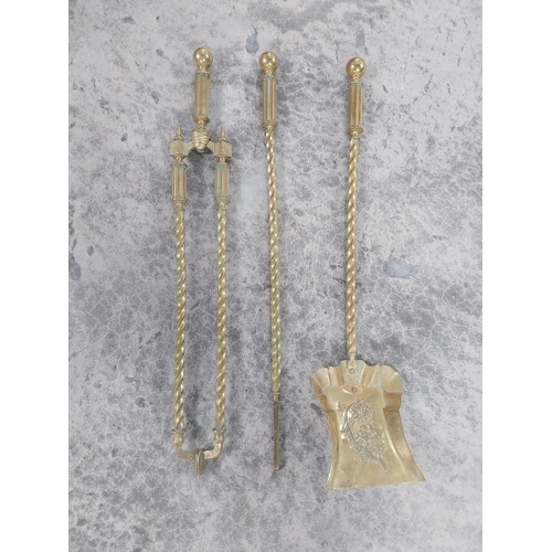 238 - Good quality brass fire companion set in the Victorian style {66 cm H}.