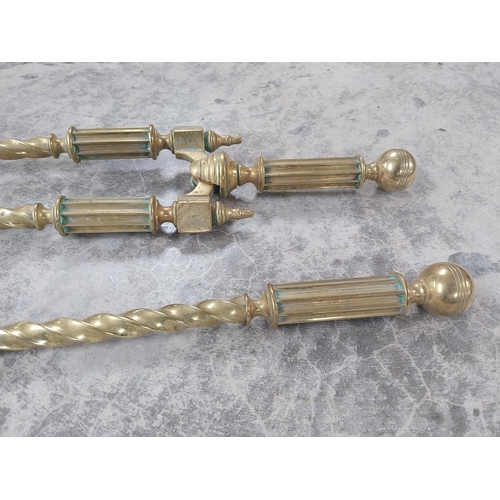 238 - Good quality brass fire companion set in the Victorian style {66 cm H}.