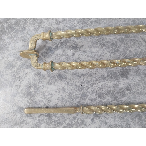 238 - Good quality brass fire companion set in the Victorian style {66 cm H}.