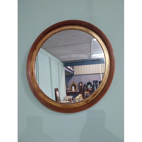 24 - Good quality walnut and gilt wall mirror {50 cm Dia.}.