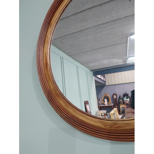 24 - Good quality walnut and gilt wall mirror {50 cm Dia.}.