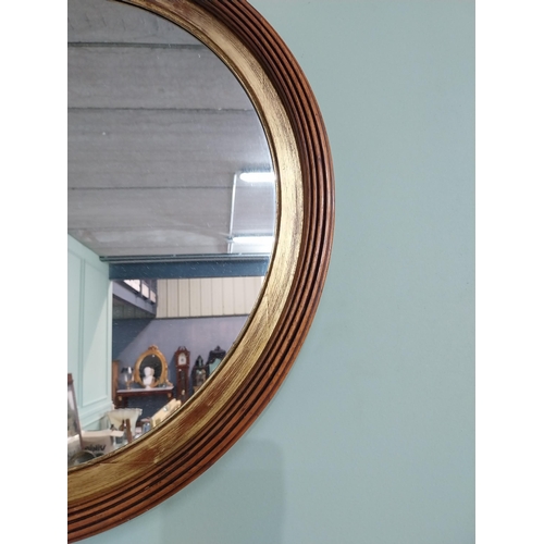 24 - Good quality walnut and gilt wall mirror {50 cm Dia.}.