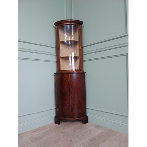 241 - Edwardian mahogany bow fronted corner cabinet with ormolu mounts {170 cm H x 57 cm W x 40 cm D}.