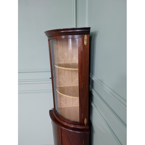 241 - Edwardian mahogany bow fronted corner cabinet with ormolu mounts {170 cm H x 57 cm W x 40 cm D}.