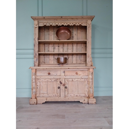 243 - 19th C. Irish pine dresser, the superstructure with two shelves and a half shelf above the bread boa... 