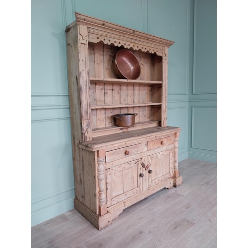 243 - 19th C. Irish pine dresser, the superstructure with two shelves and a half shelf above the bread boa... 