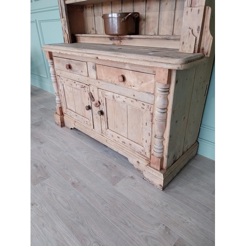 243 - 19th C. Irish pine dresser, the superstructure with two shelves and a half shelf above the bread boa... 