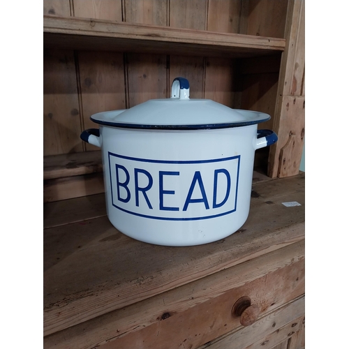 244 - Two early 20th C. enamel lidded bread bins {40 cm H x 42 cm W x 28 cm D and 28 cm H x 37 cm Dia.}.