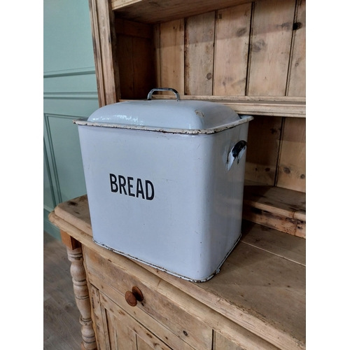 244 - Two early 20th C. enamel lidded bread bins {40 cm H x 42 cm W x 28 cm D and 28 cm H x 37 cm Dia.}.