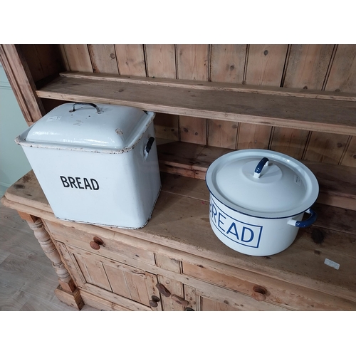 244 - Two early 20th C. enamel lidded bread bins {40 cm H x 42 cm W x 28 cm D and 28 cm H x 37 cm Dia.}.