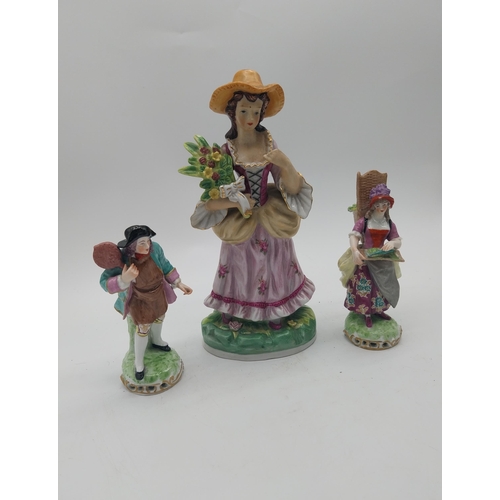 249 - Three decorative hand painted porcelain figures {27 cm H x 13 cm W x 10 cm D and 17 cm H x 7 cm W x ... 